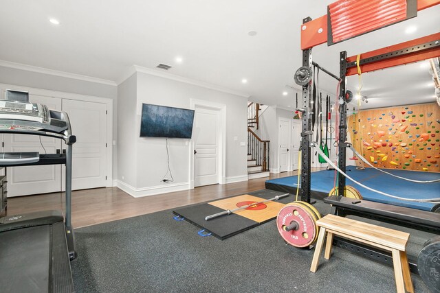2429 W Belden Ave, Chicago, IL 60647 - exercise area featuring ornamental molding, recessed lighting, and wood finished floors