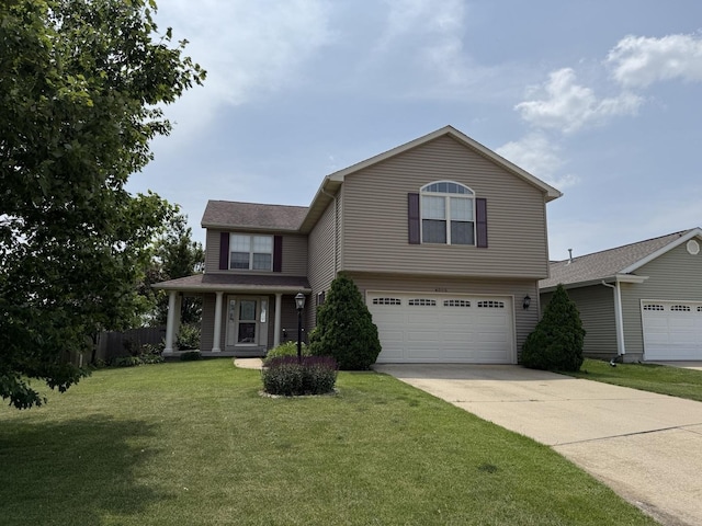 4005 Pebblebrook Ln, Champaign, IL 61822 - traditional home featuring driveway and an attached garage