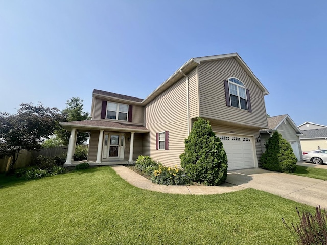 4005 Pebblebrook Ln, Champaign, IL 61822 - view of front facade with a garage, concrete driveway, and a porch