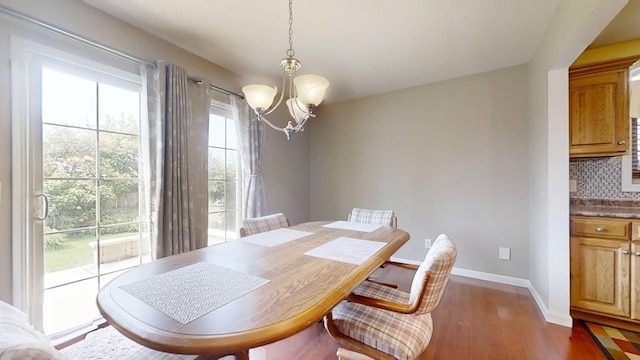 4005 Pebblebrook Ln, Champaign, IL 61822 - dining room with a chandelier and dark wood finished floors