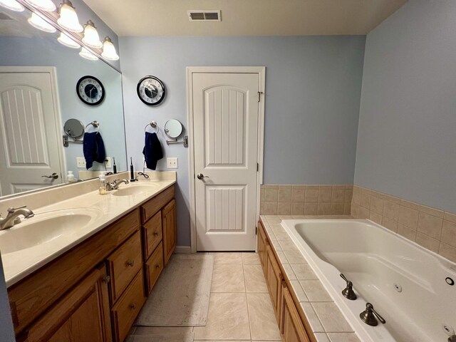4005 Pebblebrook Ln, Champaign, IL 61822 - bathroom featuring double vanity, a jetted tub, and tile patterned floors
