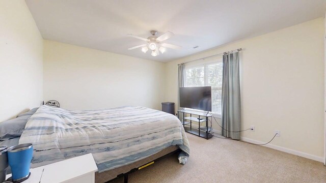 4005 Pebblebrook Ln, Champaign, IL 61822 - bedroom with light carpet and a ceiling fan