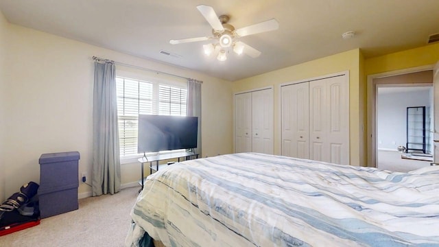 4005 Pebblebrook Ln, Champaign, IL 61822 - bedroom with two closets, carpet floors, and ceiling fan