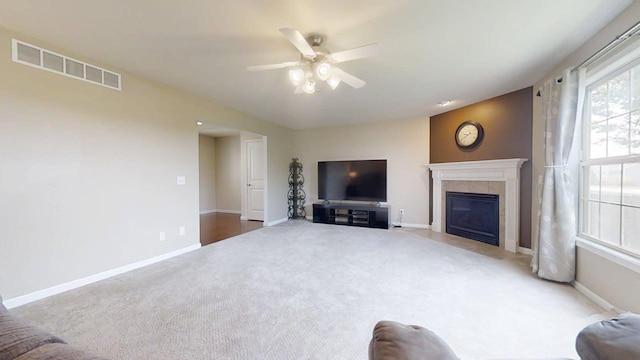 4005 Pebblebrook Ln, Champaign, IL 61822 - carpeted living room with a ceiling fan and a tiled fireplace