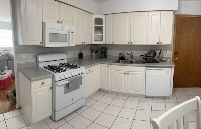7020 W Diversey Ave Unit 3, Chicago, IL 60707 - kitchen with white appliances, a sink, white cabinets, glass insert cabinets, and light countertops