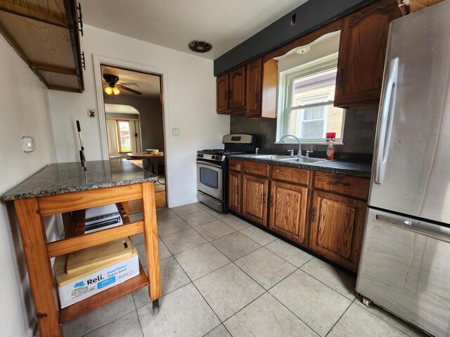 7112 W Farragut Ave, Chicago, IL 60656 - kitchen with freestanding refrigerator, gas range, a sink, and healthy amount of natural light