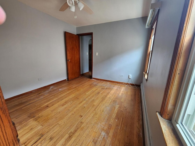 7112 W Farragut Ave, Chicago, IL 60656 - unfurnished room with light wood-style flooring, a ceiling fan, and baseboards