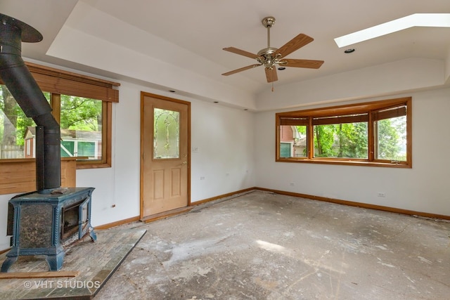 34140 N Hickory Ave, Grayslake, IL 60030 - unfurnished living room featuring a wood stove, ceiling fan, and vaulted ceiling
