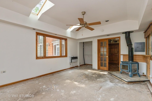 34140 N Hickory Ave, Grayslake, IL 60030 - unfurnished living room with a wood stove, electric panel, a raised ceiling, and an AC wall unit