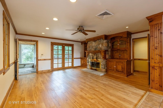 34140 N Hickory Ave, Grayslake, IL 60030 - unfurnished living room with ornamental molding, light wood-type flooring, ceiling fan, recessed lighting, and a stone fireplace