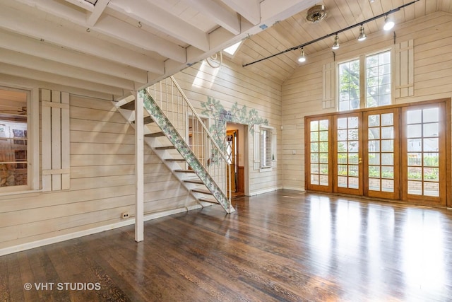 34140 N Hickory Ave, Grayslake, IL 60030 - unfurnished living room with wooden walls, wood finished floors, track lighting, stairway, and high vaulted ceiling