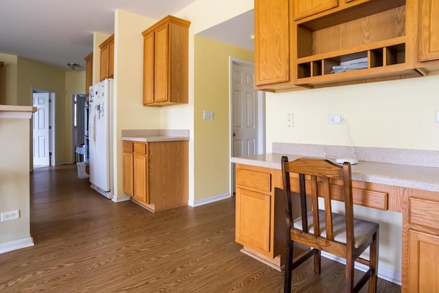 400 Bower Ln, Oswego, IL 60543 - kitchen featuring freestanding refrigerator, light countertops, dark wood-style flooring, baseboards, and brown cabinets