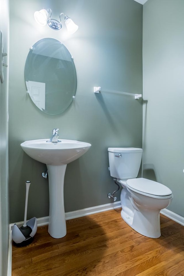 400 Bower Ln, Oswego, IL 60543 - bathroom with toilet, wood finished floors, baseboards, and a sink