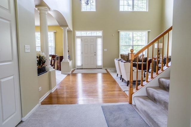 400 Bower Ln, Oswego, IL 60543 - foyer with decorative columns, healthy amount of natural light, and a high ceiling
