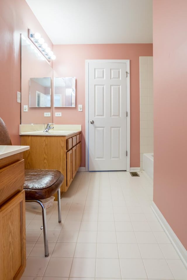 400 Bower Ln, Oswego, IL 60543 - bathroom with vanity, a tub, and tile patterned floors