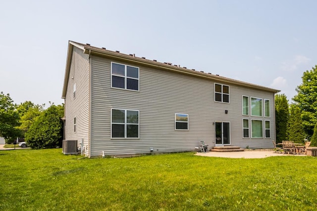 400 Bower Ln, Oswego, IL 60543 - rear view of property featuring central AC unit, a yard, and a patio area