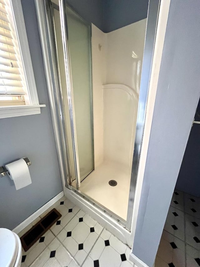 1140 Blanchan Ave, La Grange Park, IL 60526 - full bathroom featuring toilet, a stall shower, and baseboards