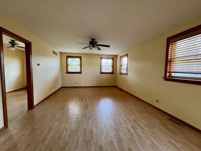 1140 Blanchan Ave, La Grange Park, IL 60526 - spare room featuring a ceiling fan, light wood-style floors, and baseboards
