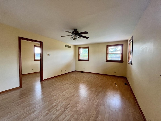 1140 Blanchan Ave, La Grange Park, IL 60526 - spare room with light wood-style flooring, a ceiling fan, and baseboards