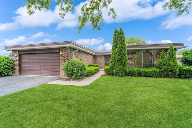 2240 Vista Ct, Northbrook, IL 60062 - view of front of property featuring brick siding, asphalt driveway, an attached garage, and a front lawn