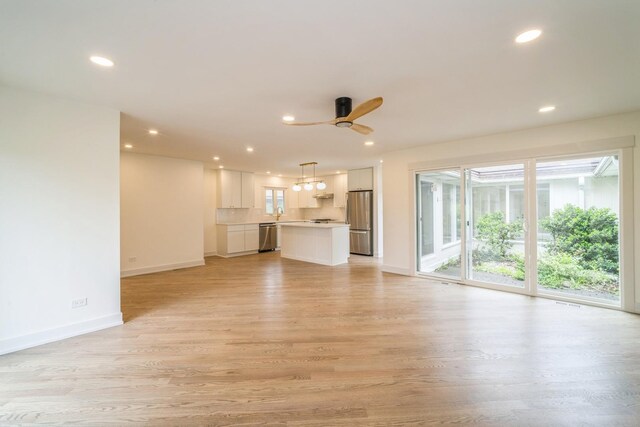 2240 Vista Ct, Northbrook, IL 60062 - unfurnished living room with light wood finished floors, recessed lighting, and a ceiling fan