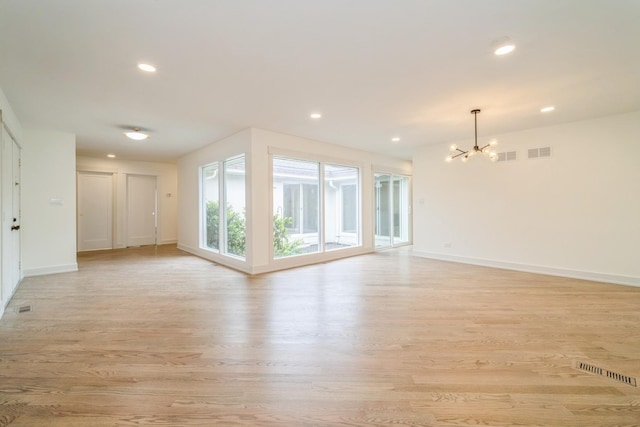 2240 Vista Ct, Northbrook, IL 60062 - unfurnished living room with a chandelier, light wood-style floors, and recessed lighting