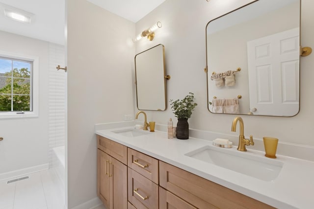 415 Fuller Rd, Hinsdale, IL 60521 - bathroom with double vanity,  shower combination, tile patterned floors, and baseboards