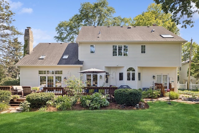 415 Fuller Rd, Hinsdale, IL 60521 - back of house with a chimney, a yard, and a deck