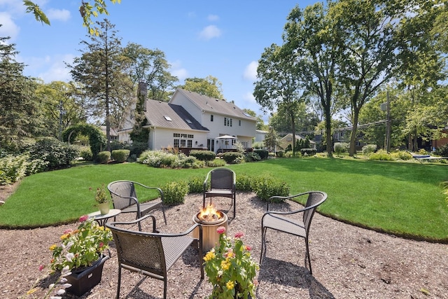 415 Fuller Rd, Hinsdale, IL 60521 - view of green lawn with a fire pit