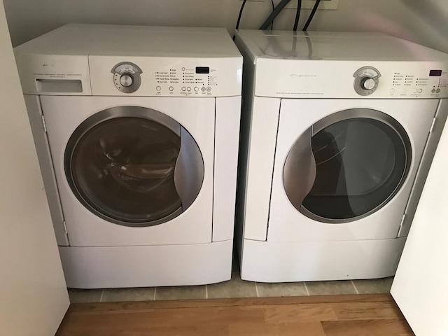 2231 W Maypole Ave Unit 201, Chicago, IL 60612 - laundry area with separate washer and dryer and wood finished floors