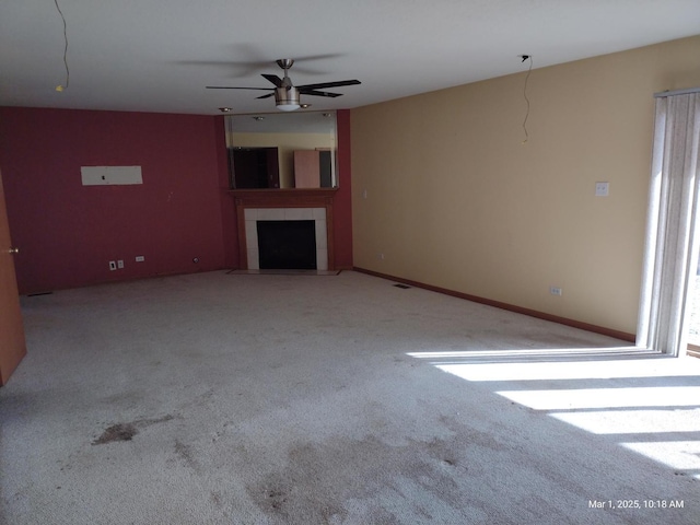 41 Manor Dr, Matteson, IL 60443 - unfurnished living room featuring carpet flooring, a ceiling fan, and a tiled fireplace