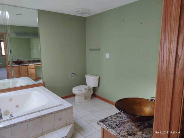 41 Manor Dr, Matteson, IL 60443 - full bath with toilet, a jetted tub, vanity, tile patterned flooring, and baseboards