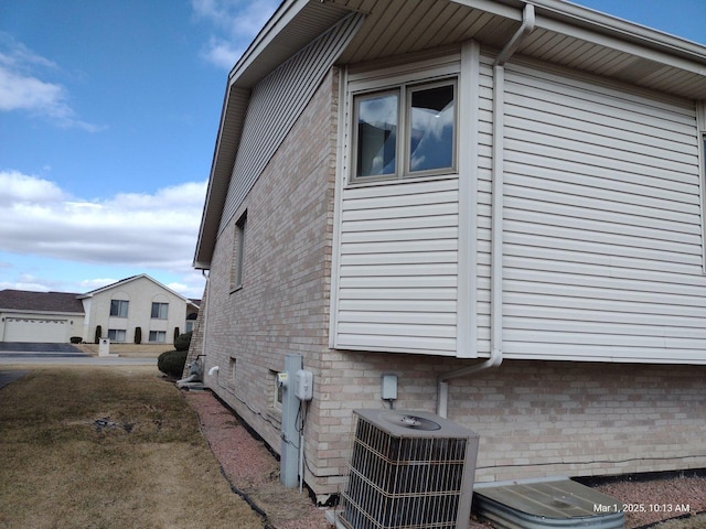 41 Manor Dr, Matteson, IL 60443 - view of home's exterior featuring central air condition unit and brick siding