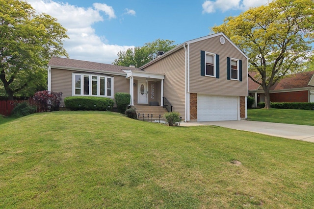 634 Primrose Ln, Schaumburg, IL 60194 - split level home with an attached garage, concrete driveway, and brick siding