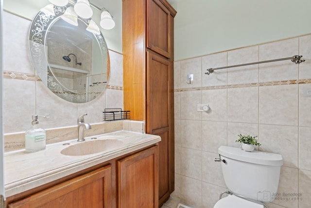 634 Primrose Ln, Schaumburg, IL 60194 - bathroom featuring tile walls, vanity, and toilet