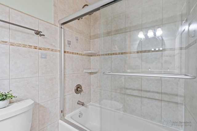 634 Primrose Ln, Schaumburg, IL 60194 - full bathroom with toilet, combined bath / shower with glass door, and tile walls