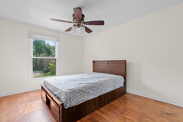 634 Primrose Ln, Schaumburg, IL 60194 - bedroom featuring wood finished floors, baseboards, and a ceiling fan