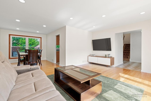 634 Primrose Ln, Schaumburg, IL 60194 - living area with light wood-style floors, recessed lighting, baseboards, and stairs