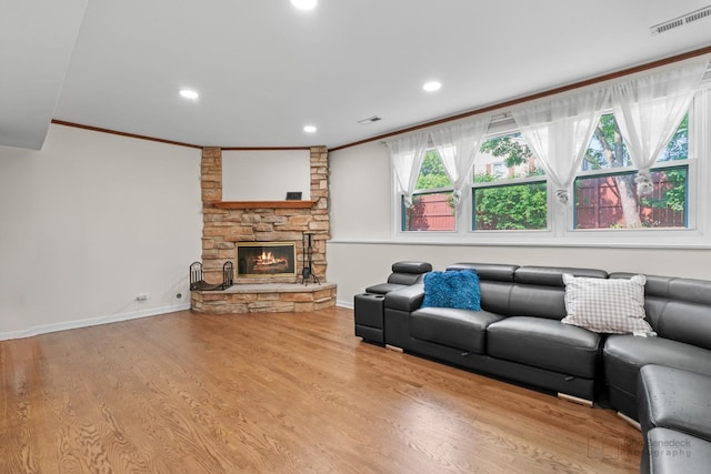 634 Primrose Ln, Schaumburg, IL 60194 - living room with crown molding, a fireplace, wood finished floors, recessed lighting, and baseboards