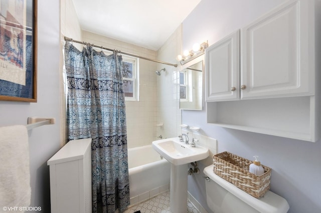 307 W Harris Ave Unit 3A, La Grange, IL 60525 - bathroom featuring toilet, shower / bathtub combination with curtain, and a sink
