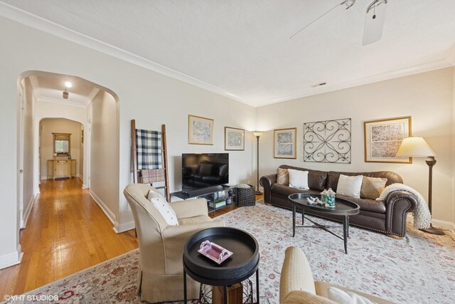 307 W Harris Ave Unit 3A, La Grange, IL 60525 - living area featuring arched walkways, crown molding, light wood-type flooring, and baseboards