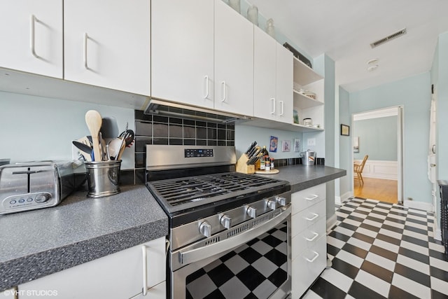 307 W Harris Ave Unit 3A, La Grange, IL 60525 - kitchen featuring stainless steel range with gas stovetop, dark floors, dark countertops, white cabinets, and open shelves