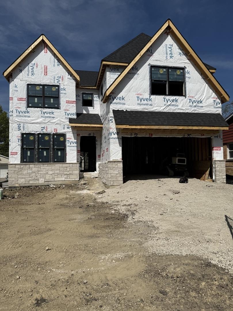 740 S Berkley Ave, Elmhurst, IL 60126 - property under construction featuring an attached garage and driveway