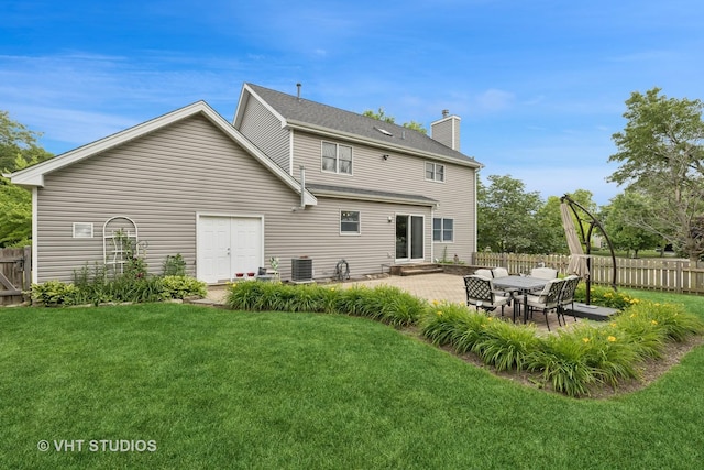 1006 Tristram Ct, West Dundee, IL 60118 - rear view of property featuring a chimney, entry steps, and a patio area