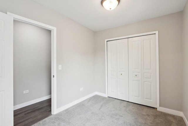 1508 N Lake Shore Dr, Round Lake Beach, IL 60073 - unfurnished bedroom featuring baseboards, a closet, and carpet