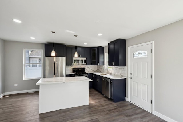 1508 N Lake Shore Dr, Round Lake Beach, IL 60073 - kitchen featuring stainless steel appliances, a sink, decorative backsplash, dark wood-style floors, and recessed lighting