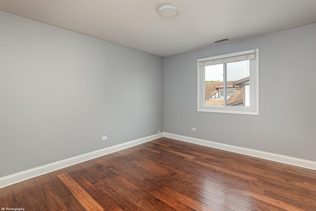 5008 W 122nd St Unit 2B, Alsip, IL 60803 - spare room featuring baseboards and dark wood-style floors