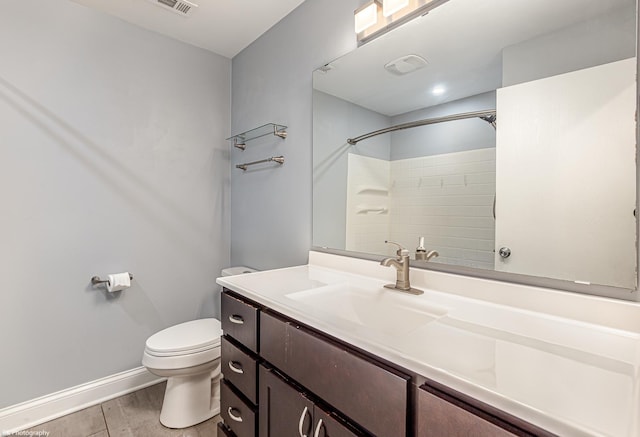 5008 W 122nd St Unit 2B, Alsip, IL 60803 - bathroom featuring toilet, vanity, wood finished floors, a shower, and baseboards