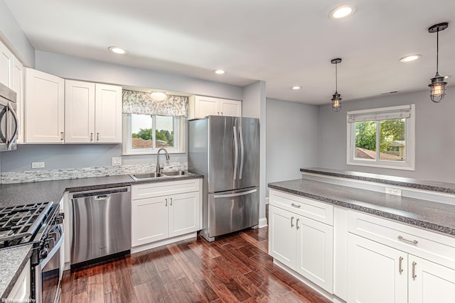 5008 W 122nd St Unit 2B, Alsip, IL 60803 - kitchen featuring stainless steel appliances, a sink, dark countertops, white cabinets, and recessed lighting