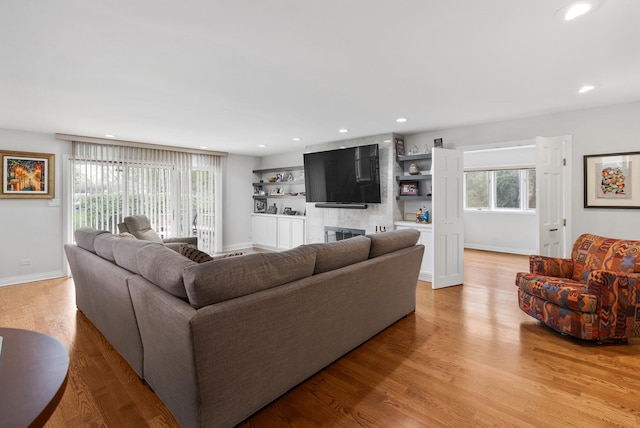 1452 Hemlock Knoll Ter, Northbrook, IL 60062 - living area with light wood finished floors, baseboards, recessed lighting, and a large fireplace